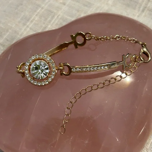 Gold and cubic zirconia focal stone with smaller cz’s each side. - Picture 4 of 9